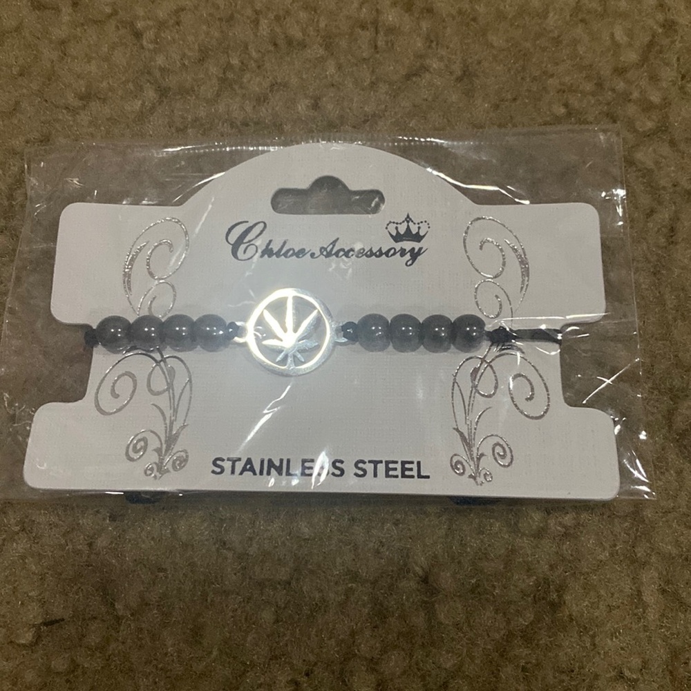 Stainless steel, black pullstring bracelet with silver setting